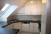 VERKAUFT: 4-Zimmer-Wohnung im Maisonette-Stil mit Dachterrasse, Balkon und Tiefgaragenbox - Moderne Einbauküche