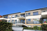 RESERVIERT: Moderne 3-Zimmer-Wohnung mit Balkon und einem Tiefgaragenstellplatz - Hausansicht