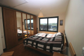 RESERVIERT: Moderne 3-Zimmer-Wohnung mit Balkon und einem Tiefgaragenstellplatz - Schlafzimmer
