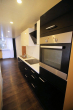 Modernisierte 2 ½-Zimmer-Wohnung mit Balkon, Schwimmbad und Sauna - Moderne Einbauküche